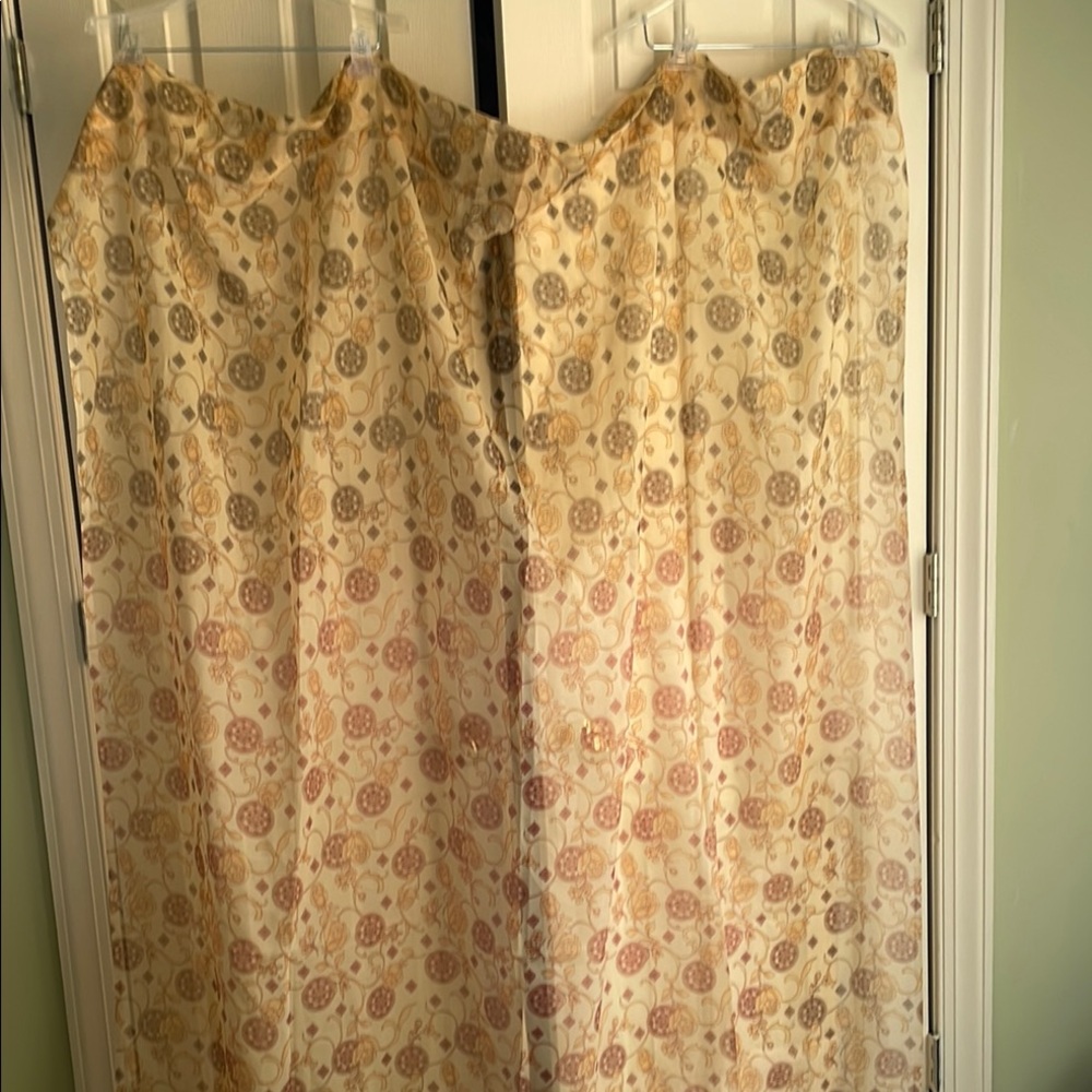 A pair of Floral Patterned Curtains